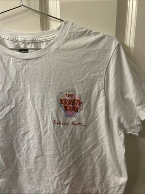 The Krusty Krab Bikini Bottom White Graphic Tee